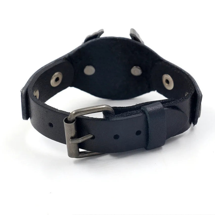 Black leather geometric bracelet with eagle watch button, showing tapered width.