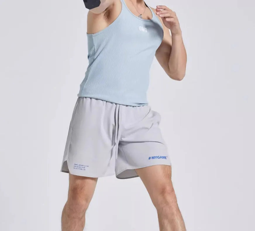 Men's four-point training shorts in a polyester blend for fitness and sports, shown in blue, black, grey, or white.