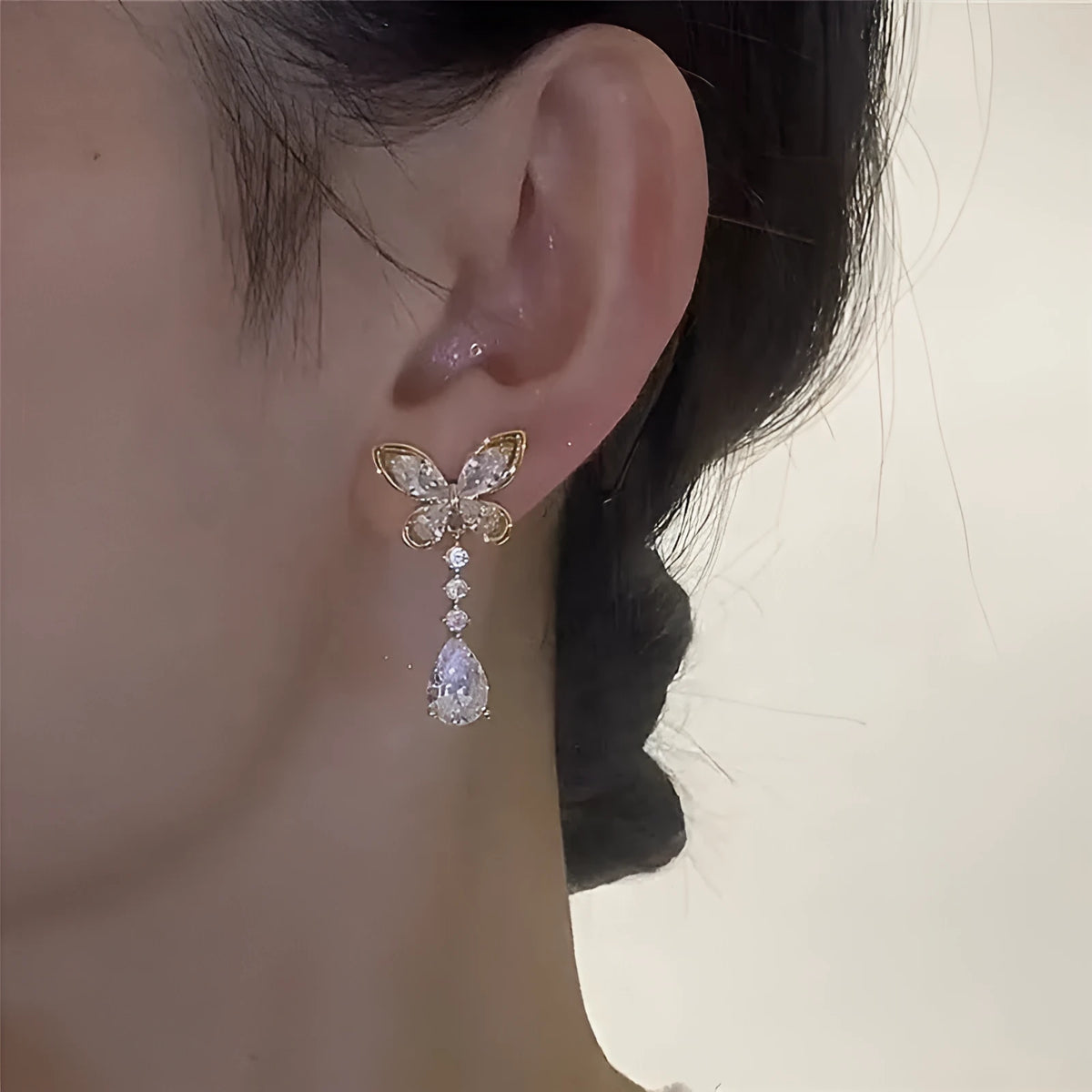 Platinum bow stud earrings with zinc alloy construction and electroplated finish