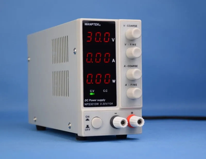 White NPS605W adjustable DC laboratory power supply with voltage and current controls for electronics repair.
