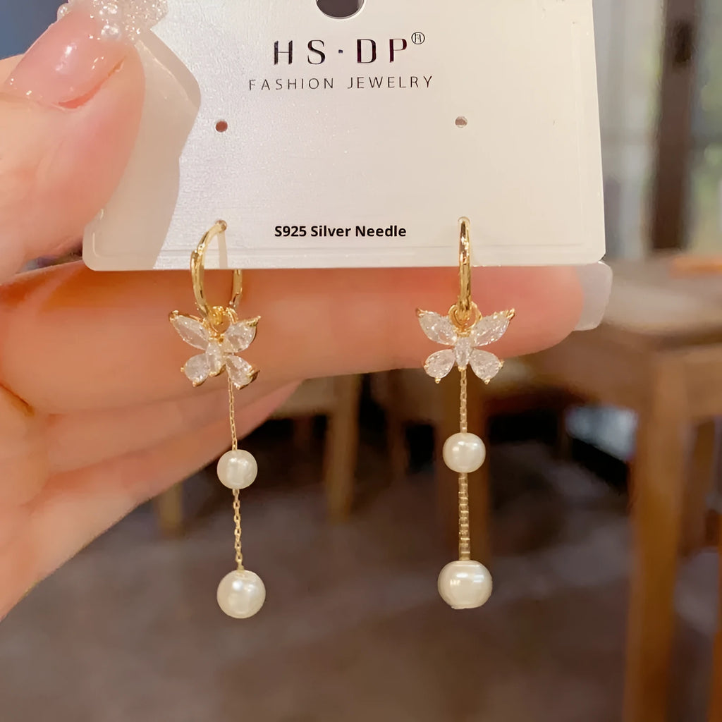 One pair of gold plated copper ear clips with butterfly pearl tassel design, clip-on style for women