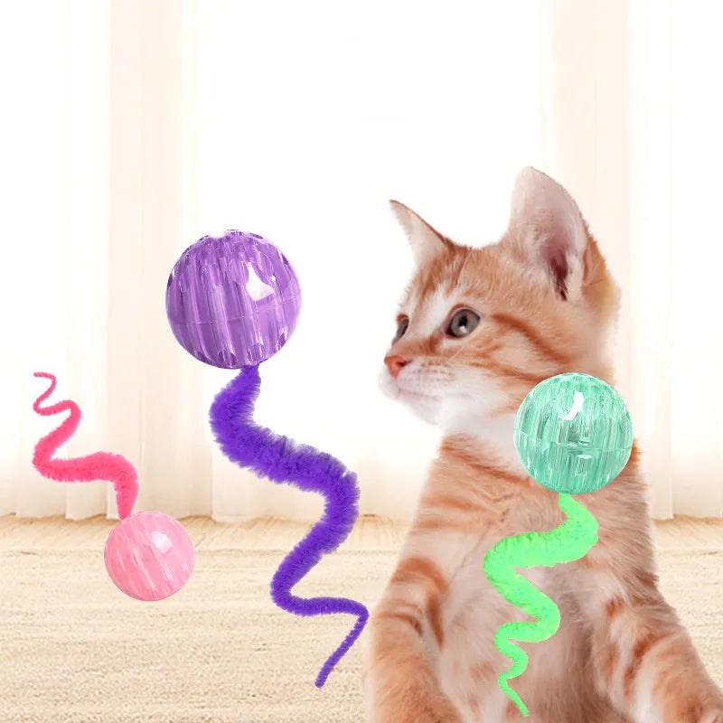 Green interactive bouncy ball cat toy with plush tail for indoor play