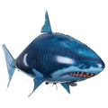 Large remote control shark inflatable balloon toy floating indoors with remote.