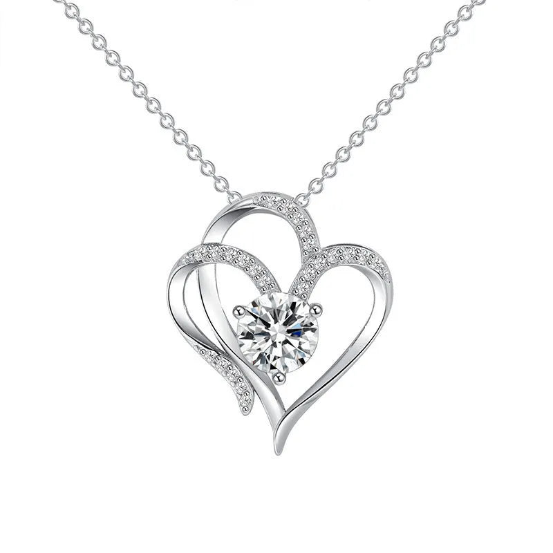 Close-up of a women's heart-shaped pendant necklace in 925 silver with a diamond-treated finish