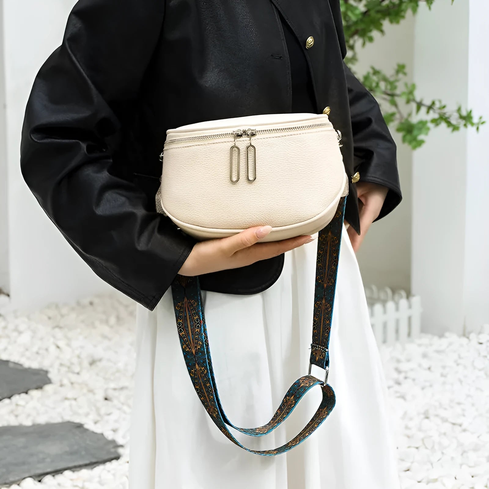 Women's soft PU leather messenger bag in saddle shape with cross-body strap and internal organisation