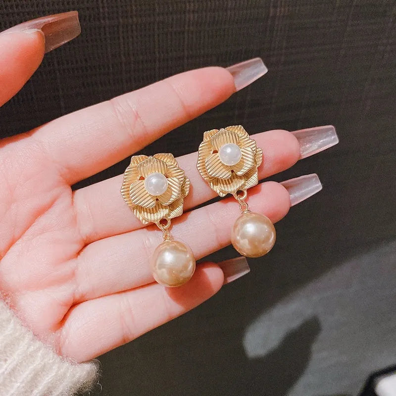Gold colour stud earrings with rose pearl design, opal stones, and ice flower elements