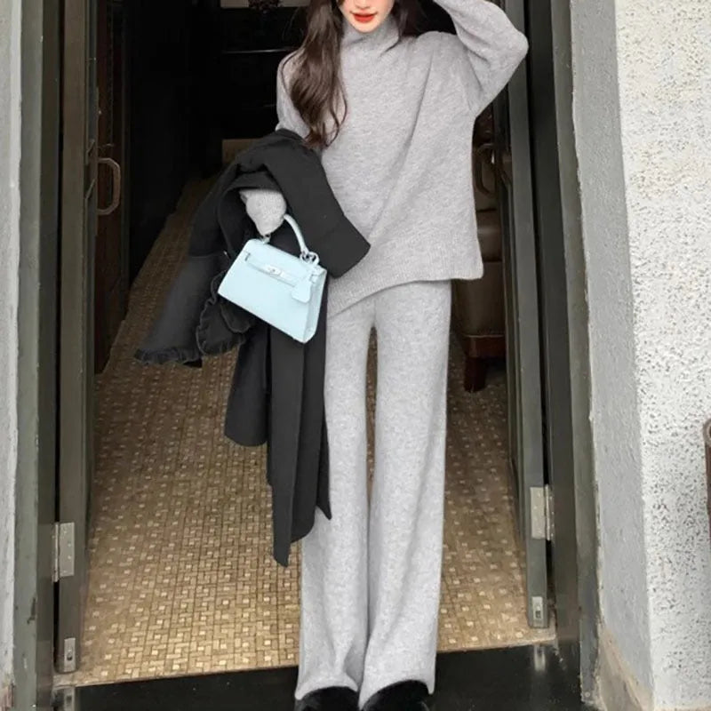Women's milky white acrylic knit sweater and wide-leg trousers two-piece casual set.