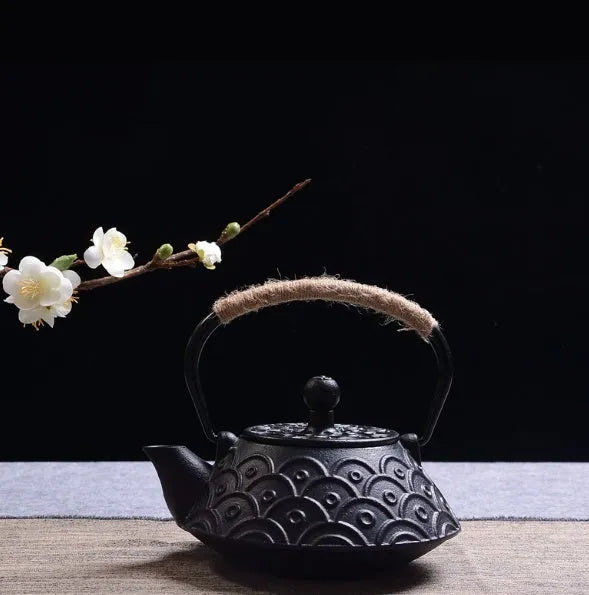 Japanese style cast iron teapot with 0.9 litre capacity shown in a bronze finish.