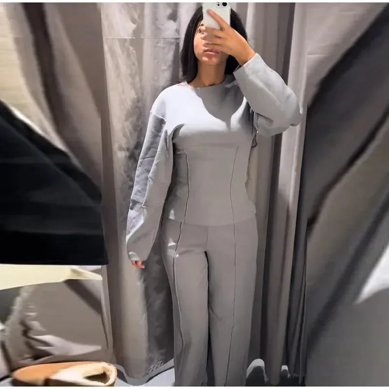 Women's polar fleece suit set with long sleeve O-neck top and wide leg trousers in multiple colour options.