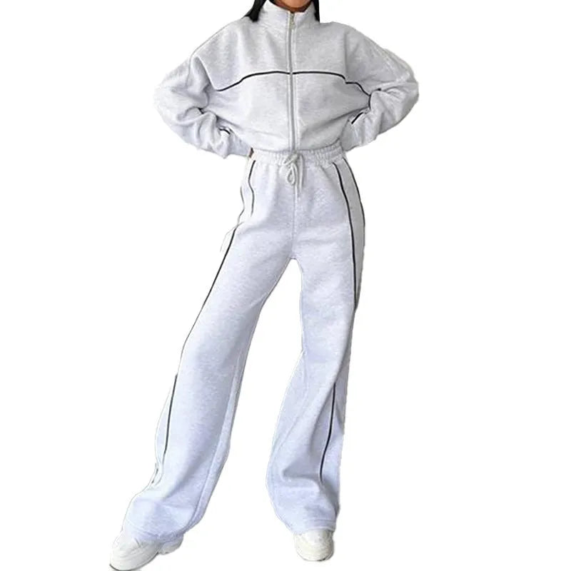 Casual striped suit set comprising a long sleeve mock neck hoodie and matching lace-up trousers.
