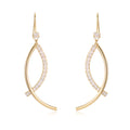 Pair of gold irregular geometric copper earrings on display