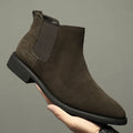 Men's pointed suede short Martin boots in black with cowhide upper and pigskin lining on a neutral background