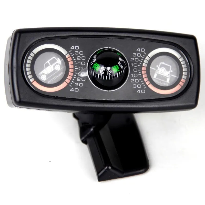 Black car inclination meter with ball balancer and self-adhesive base on dashboard