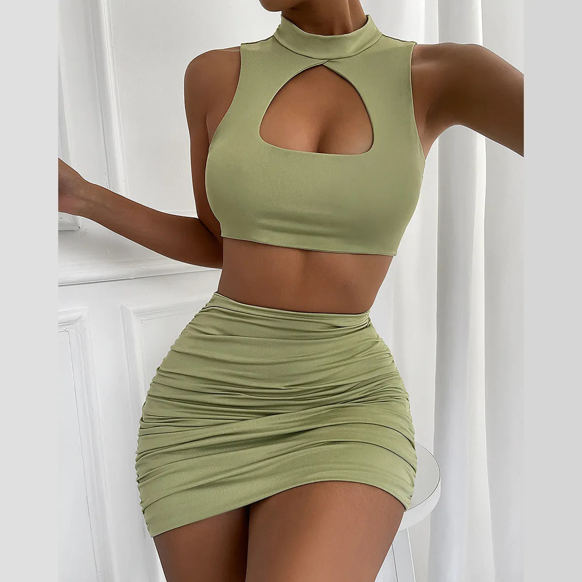 Light purple women's hollow vest and split skirt two-piece co-ord set on a model.