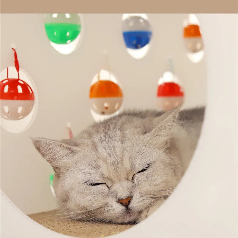 Integrated cat scratch board with attached tunnel containing bell ball and combined pet bed area