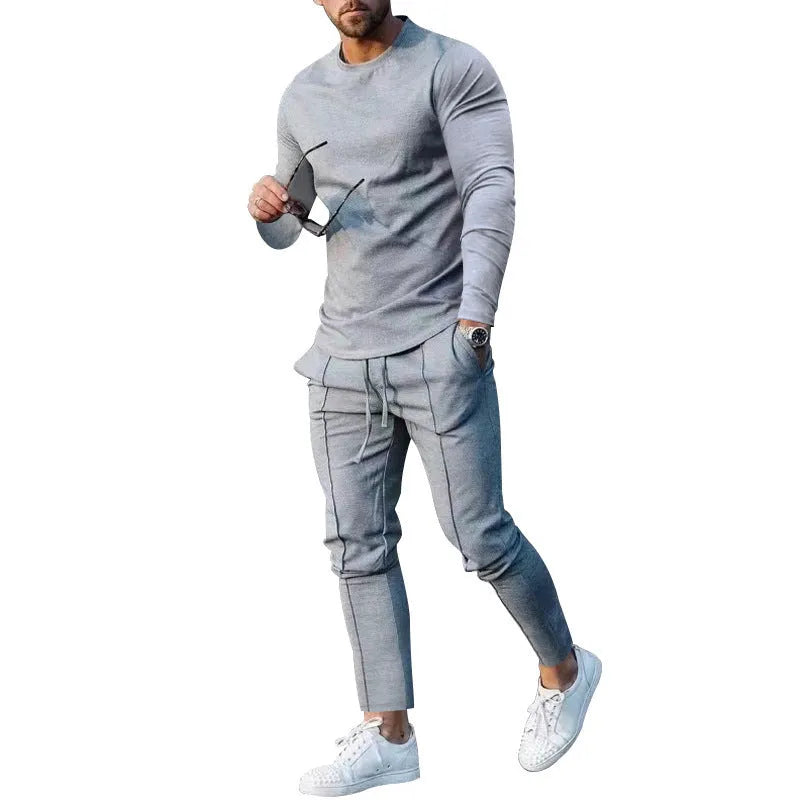 Men's light grey two-piece casual suit with long sleeve T-shirt and trousers on a hanger.