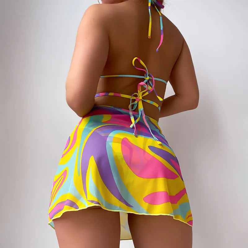 Yellow striped halter-neck lace-up bikini top with matching skirt and shorts.
