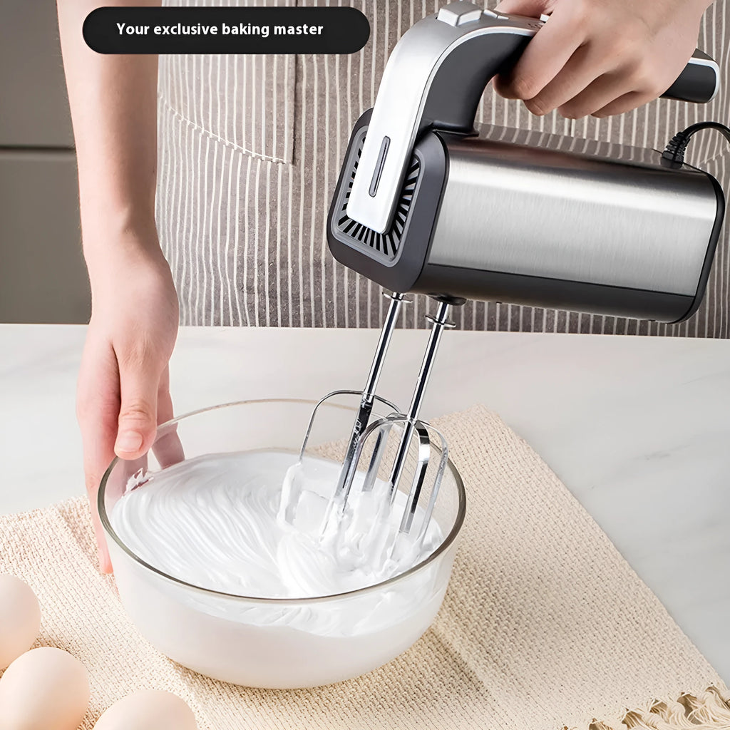 Silver handheld electric kitchen whisk with beaters on a countertop