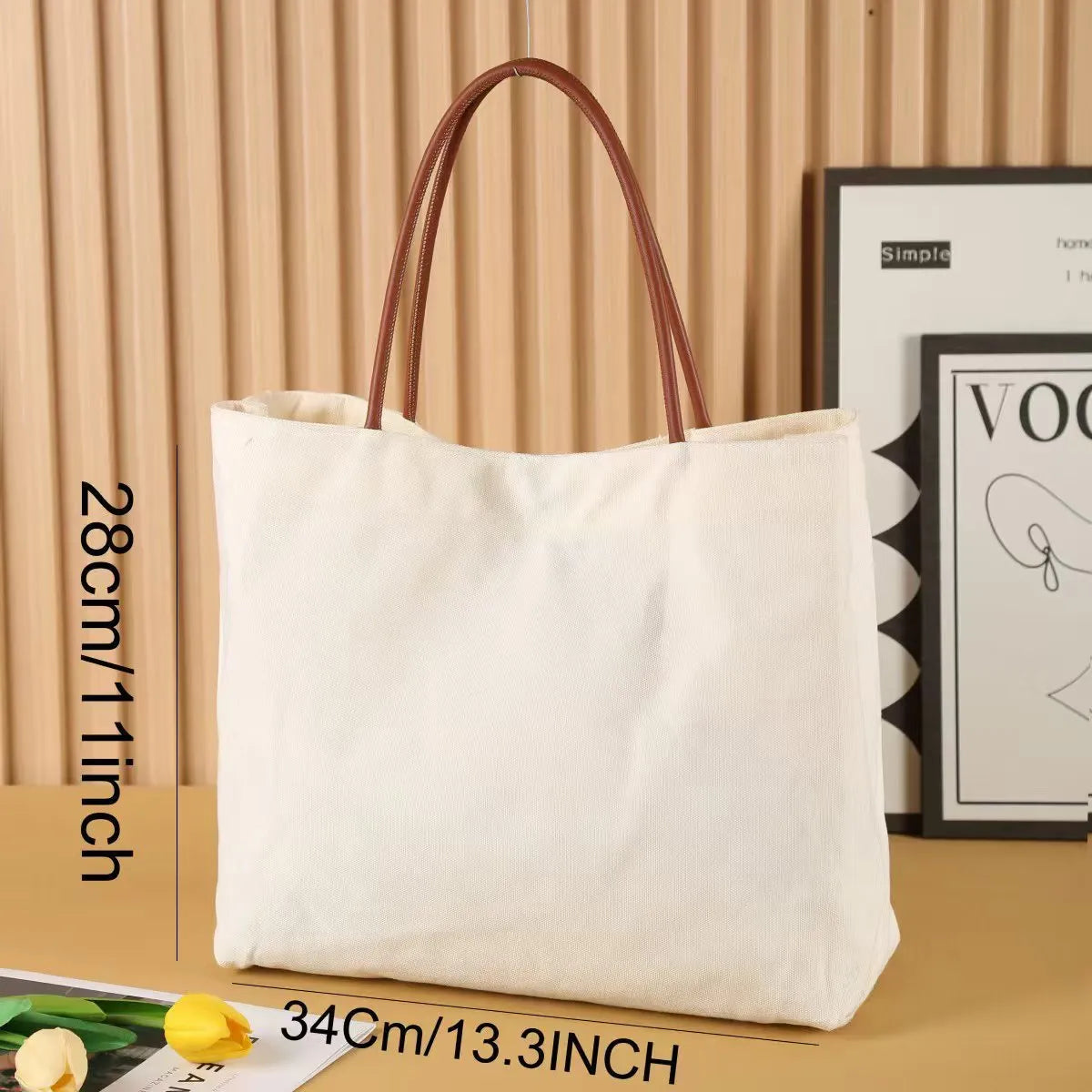 Large beige white canvas tote bag with a reinforced flat base and roomy interior.
