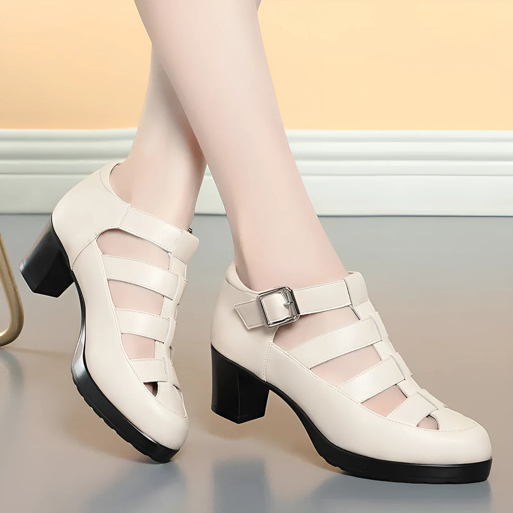 Women's beige closed toe sandals with a chunky heel, woven upper, and ankle strap buckle.