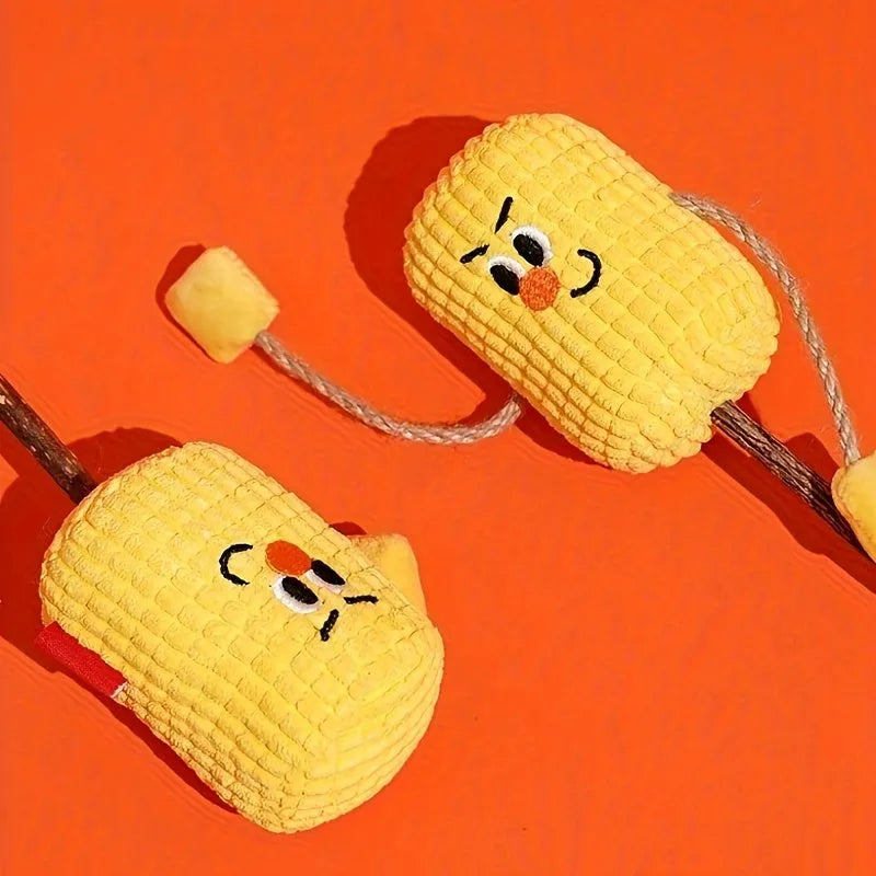 Corn cob shaped cat toy made from natural polio wood on a white background.