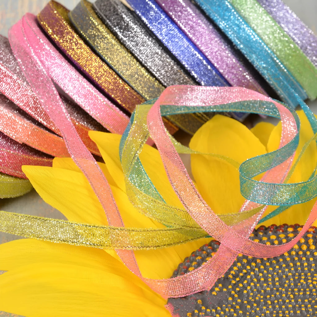 Green onion coloured polyester ribbon with gold and silver wire patterns on 25-yard roll