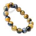 Handmade Fantasy Tigereye agate gemstone bracelet with round beads on a wrist.