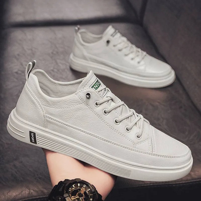 Men's white casual shoes with round toe, flat bottom, and shallow opening