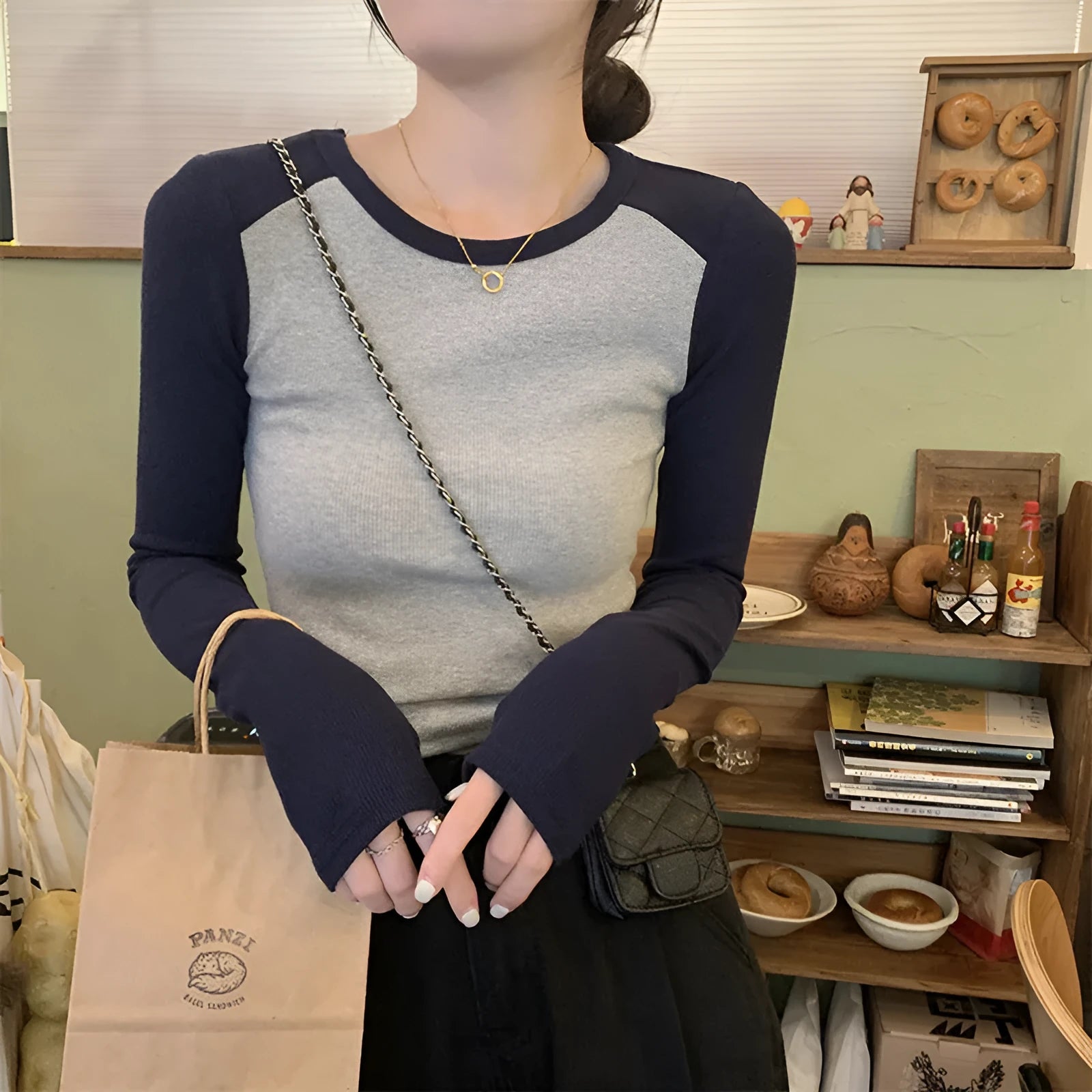 Women's dark blue oversized viscose top with princess sleeves and embroidery detailing.