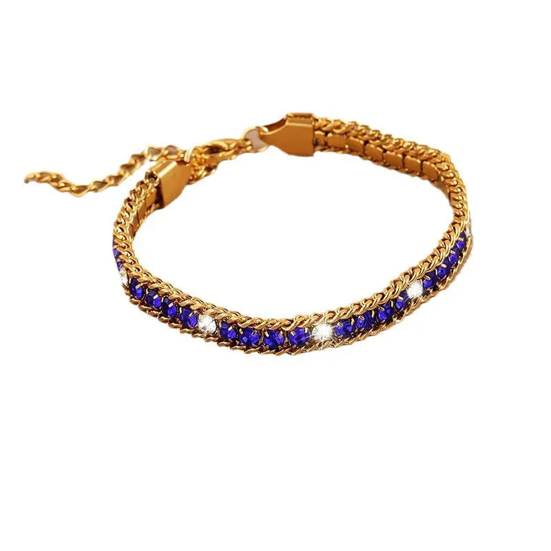 Three-layer gold electroplated stainless steel chain bracelet on women's wrist with geometric links