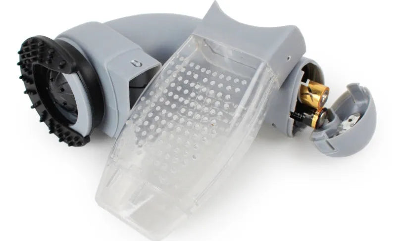 Grey portable electric pet hair vacuum cleaner with soft rubber grooming head.