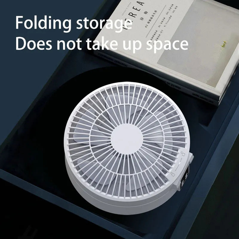 White remote control rechargeable USB folding fan with night light on desk