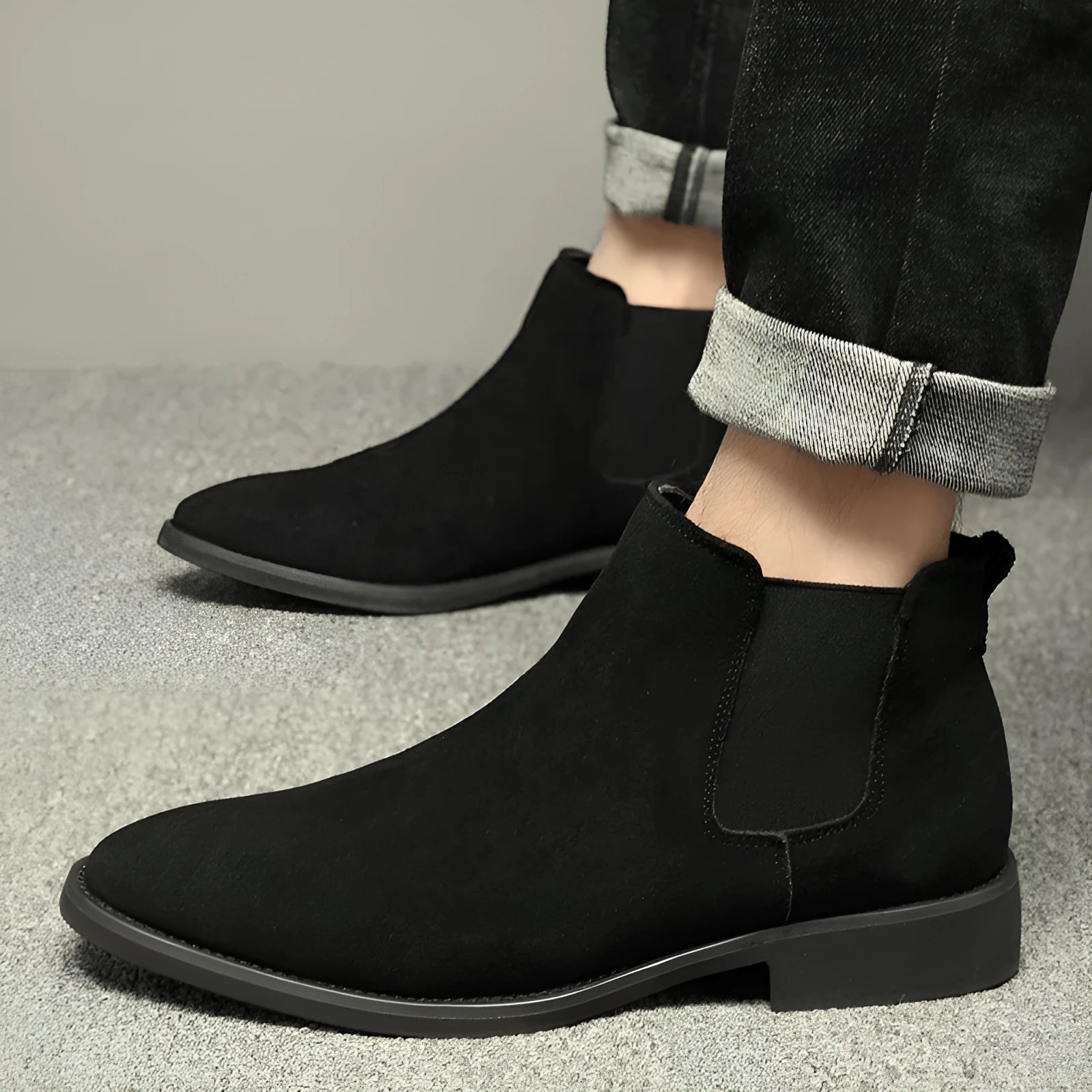 Men's pointed suede short Martin boots in black with cowhide upper and pigskin lining on a neutral background
