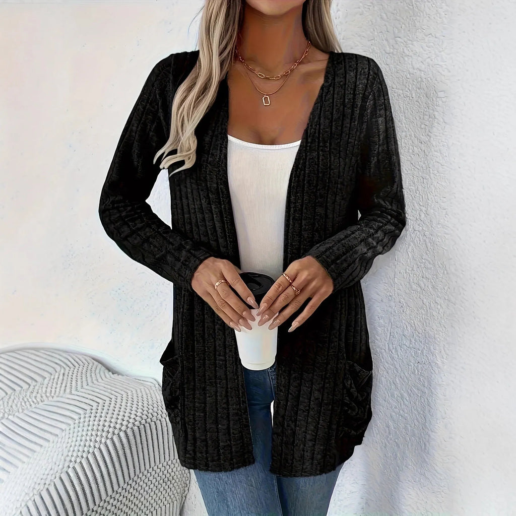 Long sleeve loose fit cardigan in grey with a pocket, shown on a hanger.