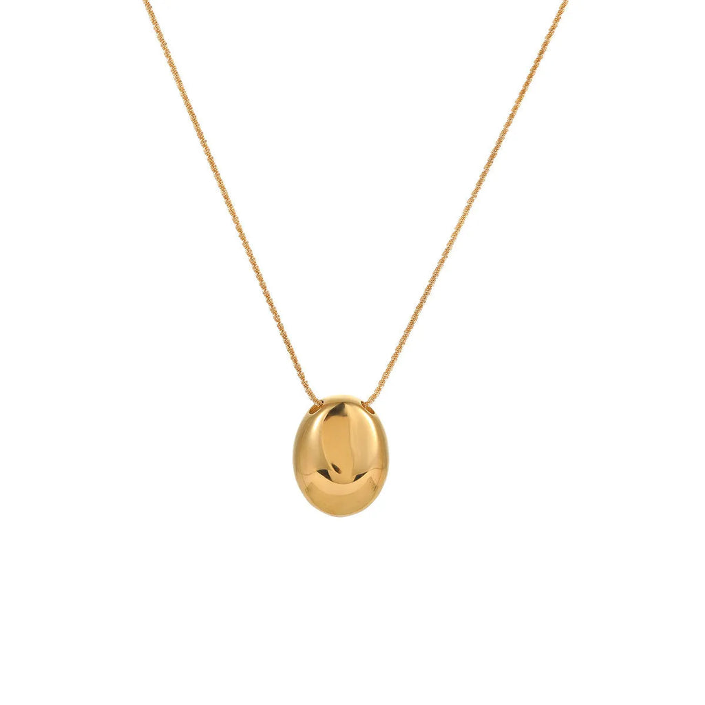 Gold-plated geometric necklace with stainless steel chain on display showing pendant detail