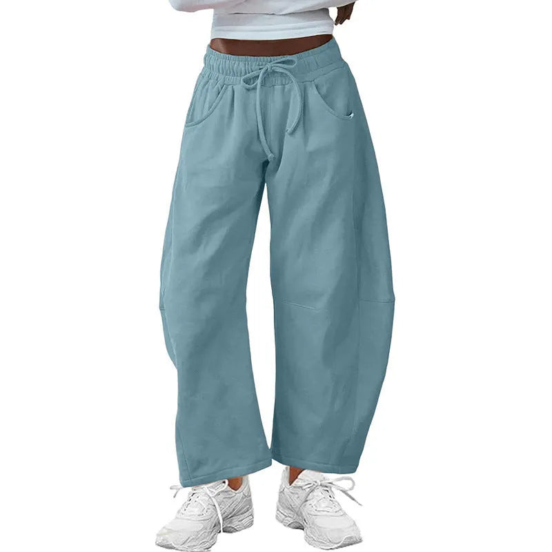 Loose cropped cotton sweatpants with drawstring waist and side pockets in street fashion style