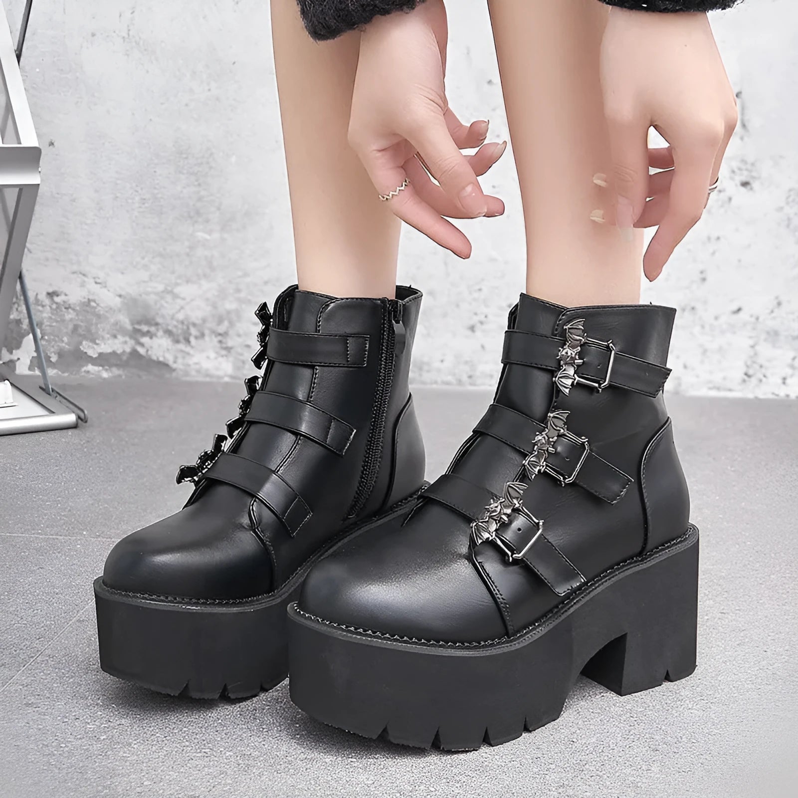Black women's Harajuku punk gothic Martin boots with bat buckle, platform sole, and side zip.