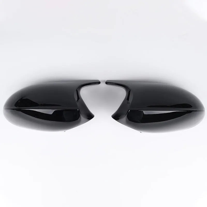 Pair of black ABS plastic rearview mirror shells for BMW 3 Series E90 door mirrors.