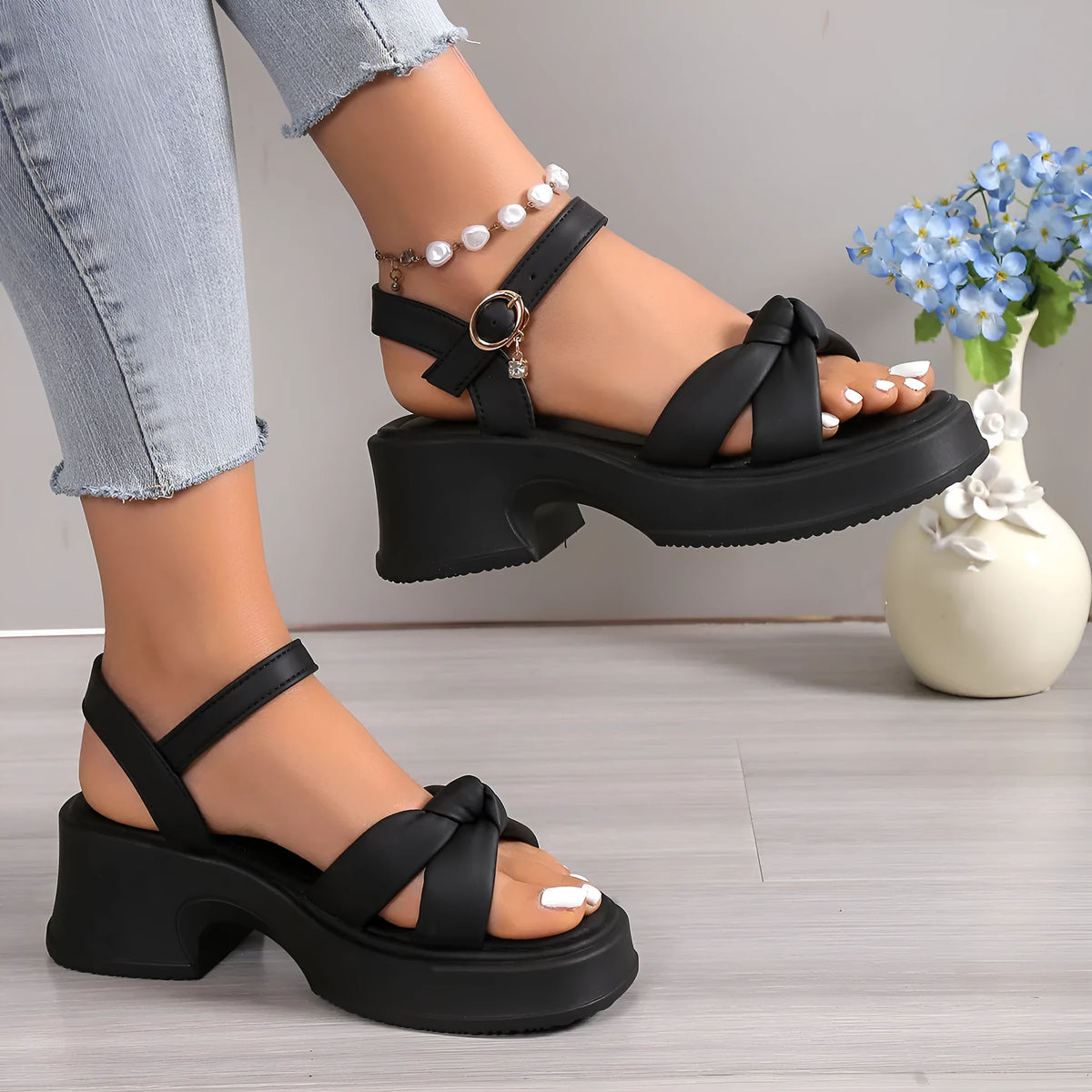 Women's black high heel slippers with thick platform sole and button closure
