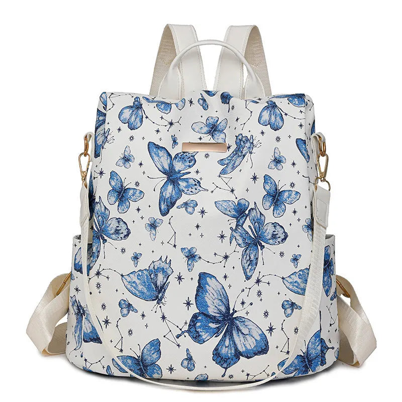 Butterfly print backpack with sewing line detail shown in multiple colour options