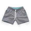 Men's straight leg beach shorts in polyester available in multiple colours and plus sizes.