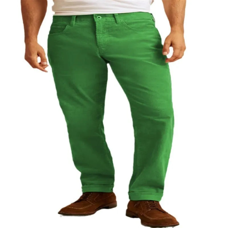 Man wearing loose fit straight-leg corduroy trousers in a solid colour.