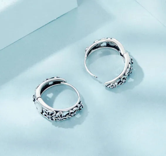 Sterling silver retro butterfly earrings with hollow design and zircon detailing