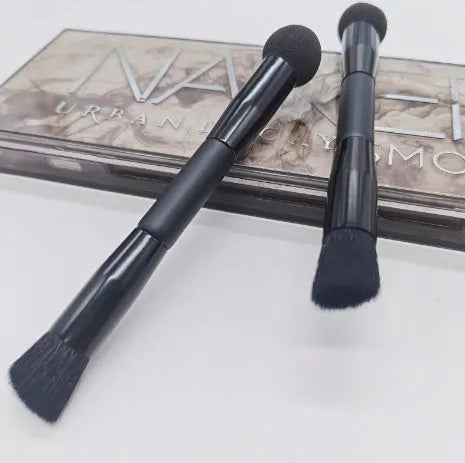 Double-headed makeup brush with black miter sponge and artificial fibre bristles on wooden handle