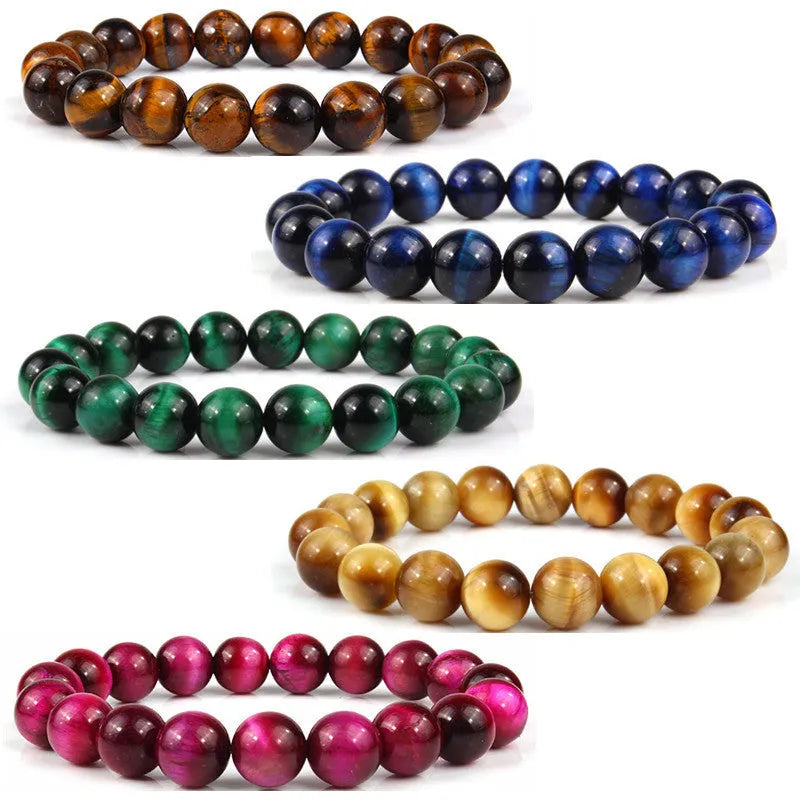 Finished round tiger eye crystal bracelet in multiple colour options on a wrist.