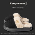 Pair of plush fleece slippers with textured PVC sole and cross stitching detail.