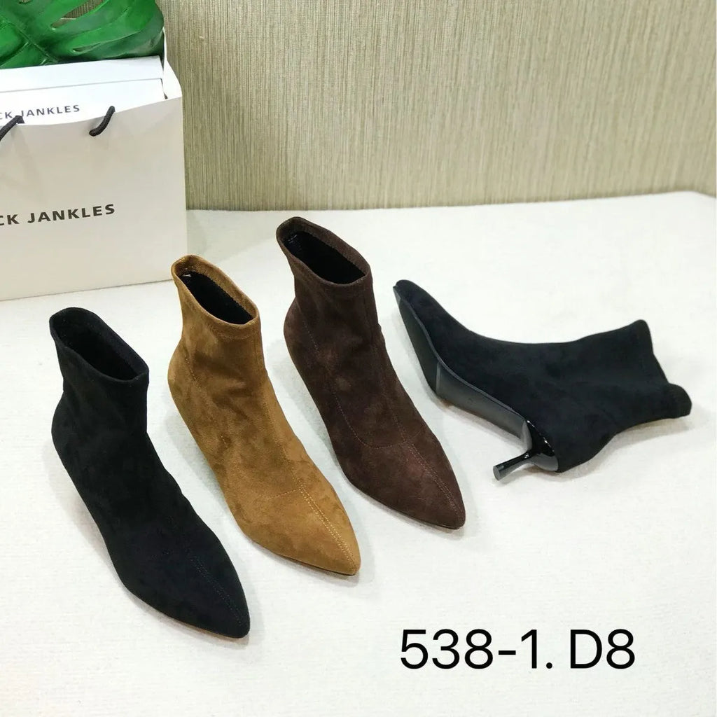 Black pointed toe women's ankle boot with high stiletto heel and mid-calf shaft on a plain background.