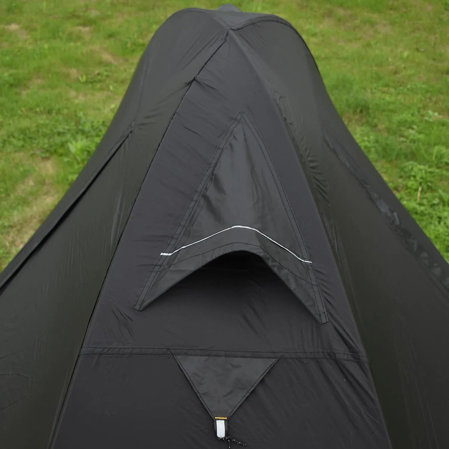 Single person camping tent with aluminium poles in black colour showing double-layer construction
