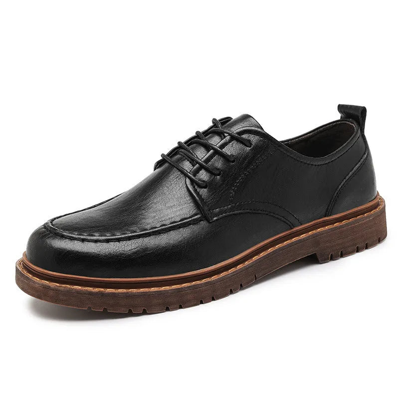 Men's black casual leather shoes with a round toe and flat rubber sole on a white background