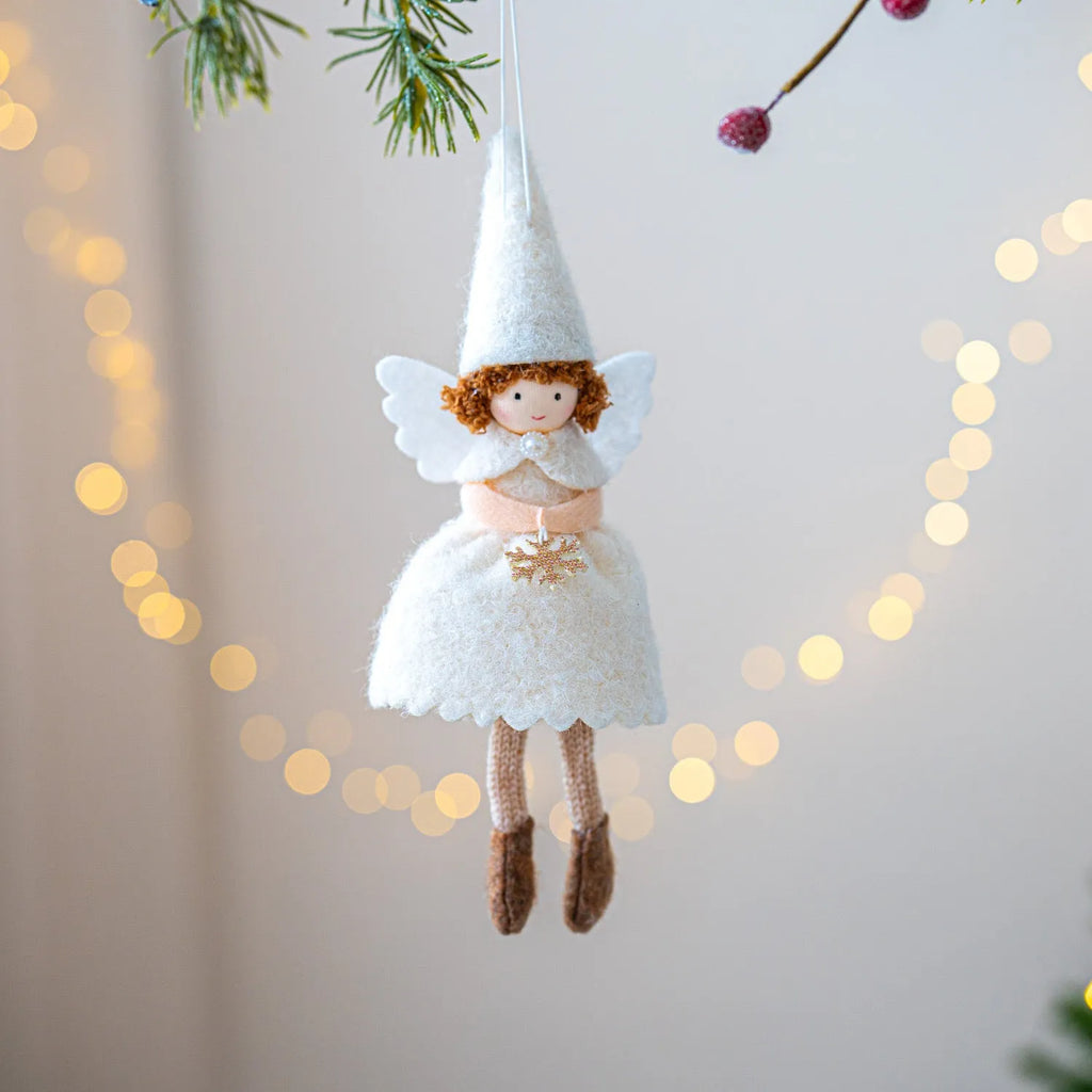 Close-up of a white cloth angel skirt felt pendant Christmas tree ornament.